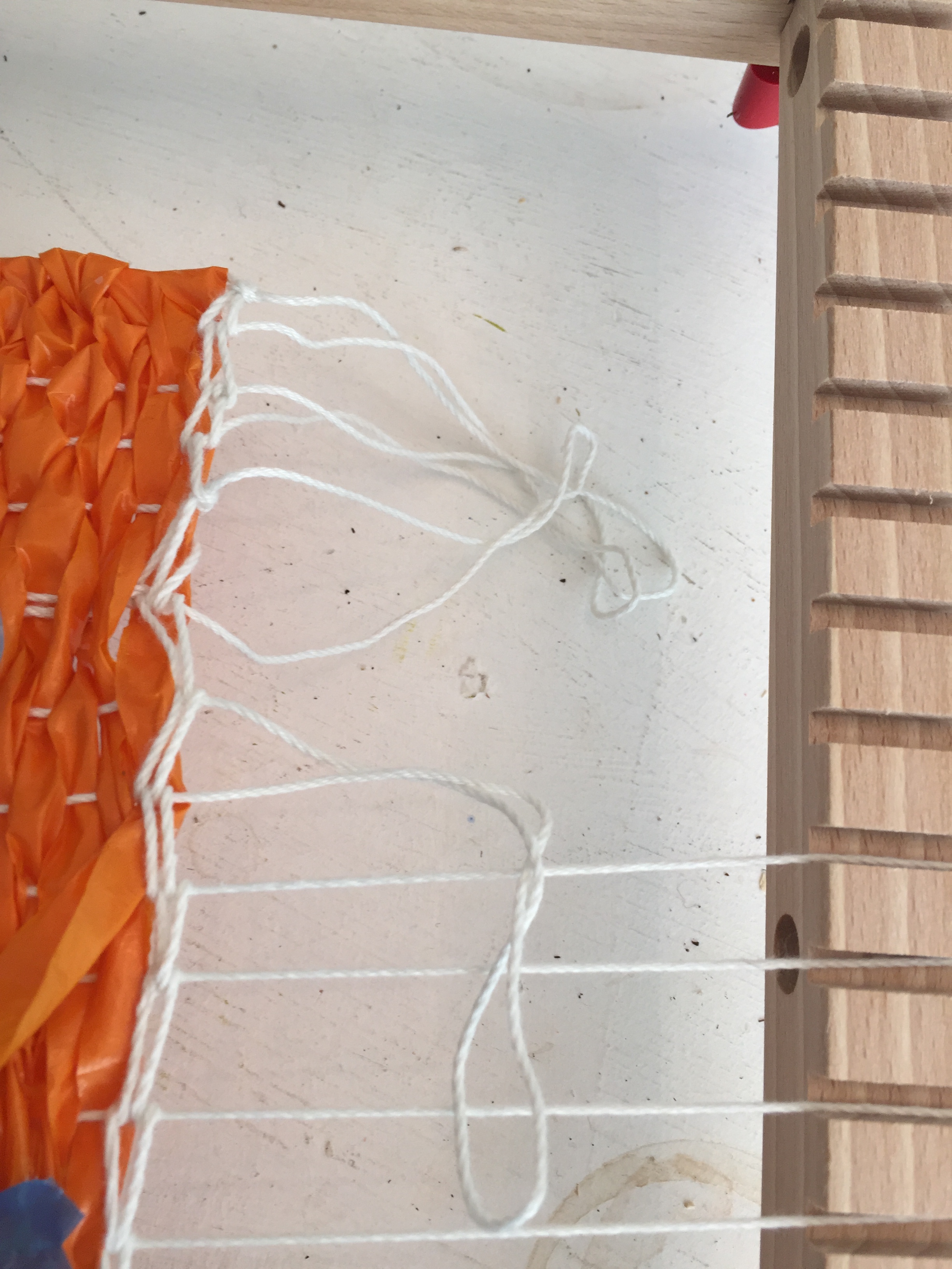 10Pull the ends of the yarn off the loom